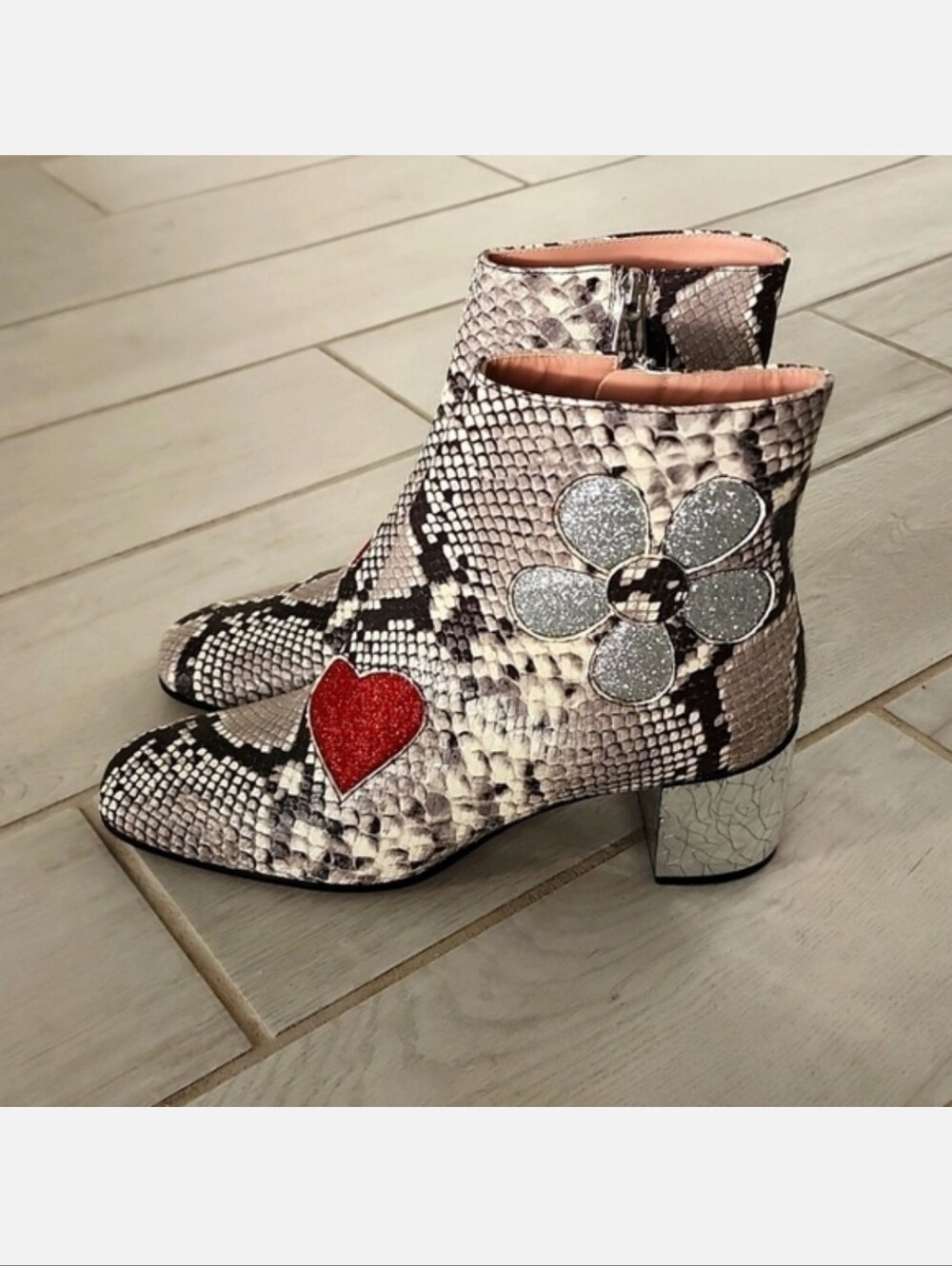 Roberto Festa python-print ankle boots embellished with a glittery red heart